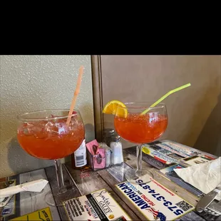two cocktails on a table