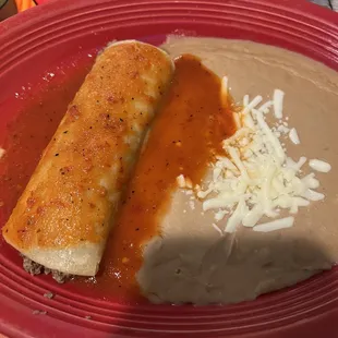 Enchilada with red sauce instead of cheese dip. It's surprising that there wasn't any cheese on it.