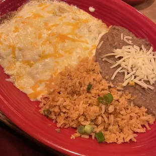 Cheese Enchiladas with sour cream sauce. Rice &amp; refried beans.