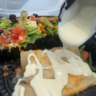 Chicken enchiladas with sour cream cheese sauce