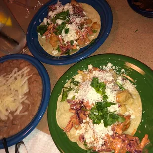 Fish taco. Shrimp taco and refried beans.