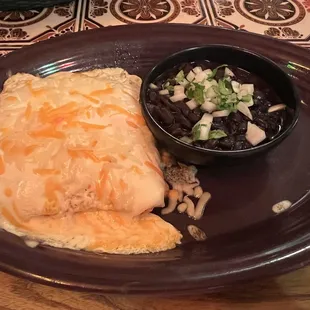 Chicken enchiladas sour cream sauce. Black beans.