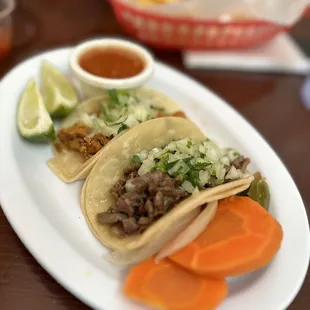 a plate of tacos and carrots