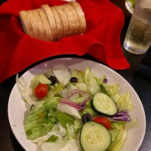 Side salad and lunch and loaf of fresh bread