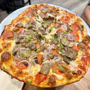 If you ENJ(*‿*)Y black olives, mushrooms, onions, pepperoni and sausage, highly recommend Carmelo's Supreme.