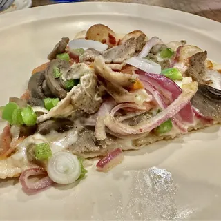 Carmelo's Supreme Pizza Slice