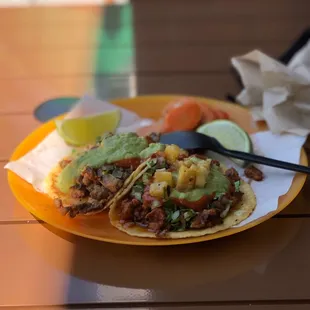 a plate of tacos on a table