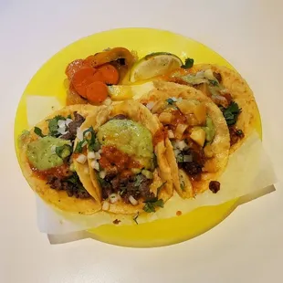 Carne asada tacos and al pastor tacos