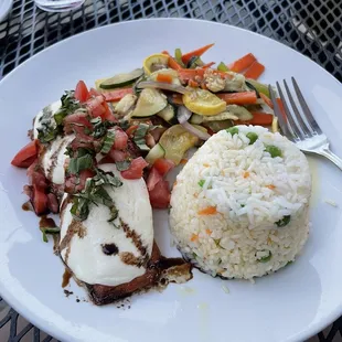 Salmon caprese, veggies, and rice.