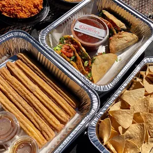 Rice, beans, chips, salsa, tacos, churros