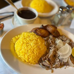 Lechon Asado Yellow Rice Black Beans Plantains