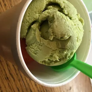 Avocado ice cream on top and strawberry sorbet underneath