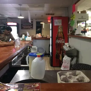 a man and a woman sitting at a bar