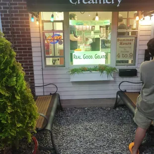 a woman standing in front of a store