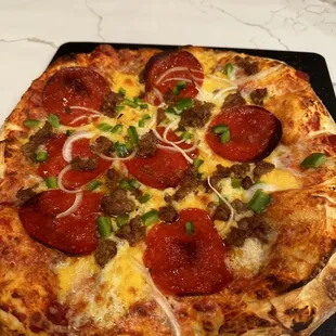 Ingredients purchased at the store, dough, pepperoni, sausage.