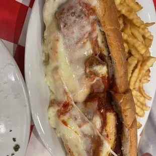 Chicken Parmigiana Sub with fries.