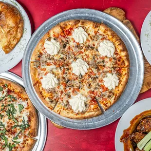 Variety of pizza, wings, stromboli, calzone