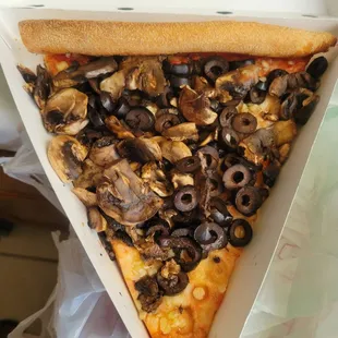 Pizza with uncooked mushrooms + olives, uncooked, just dumped onto pizza bread not even melted into it.