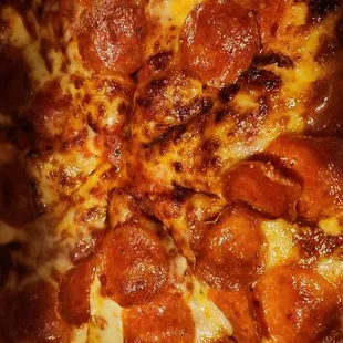 a pepperoni pizza in a box