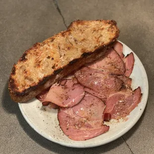 Hot smoked coppa with dried clam, lemon oil, and black pepper