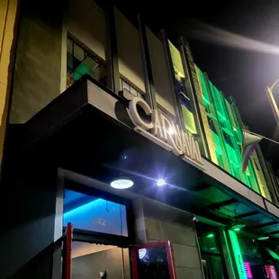 the front of a building at night