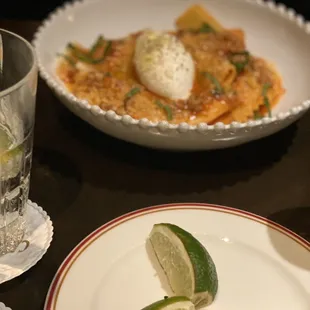 a plate of food and a glass of water