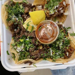 Carne asada &amp; carnitas tacos with salsa