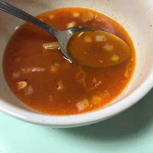 a bowl of soup with a spoon