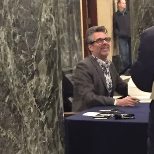 Michael Chabon signing books.