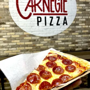 a slice of pepperoni pizza