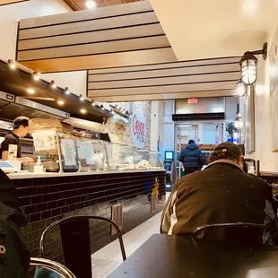 a man sitting at a table in a restaurant