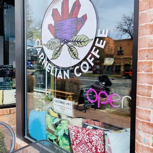 a storefront window with a sign on it