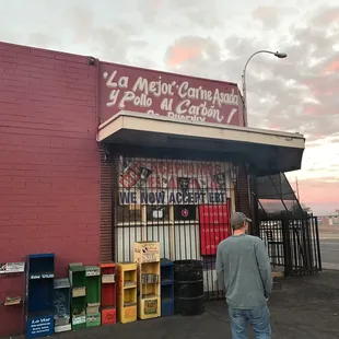 a man standing in front of a store