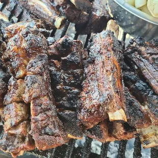 ribs and potatoes on a grill