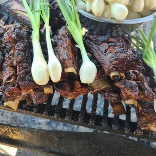 ribs and onions on a grill