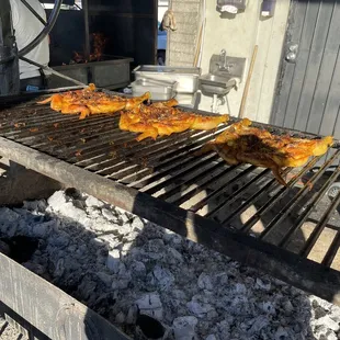 a grill with chicken on it