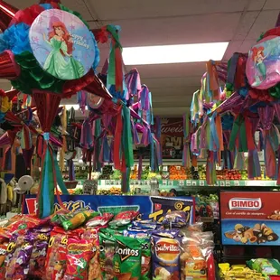a display of candy and balloons