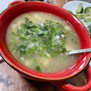 White Menudo with cilantro and onions and lime.