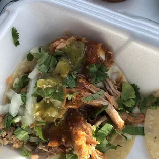 Carnitas taco with green and red salsa