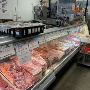 Other end of meat case... and. The cart full of fresh salsas