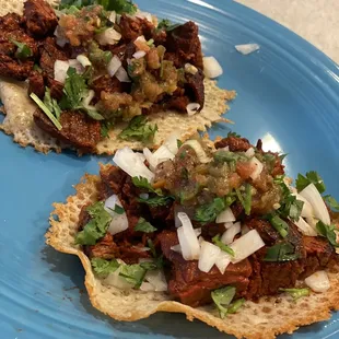 Grilled up their Carne, chopped onions and cilantro, their mild salsa with Jack cheese shell.