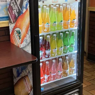 a refridgerator filled with drinks