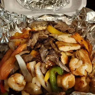 Chicken steak and shrimp fajitas