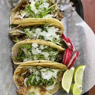 three tacos on a tray