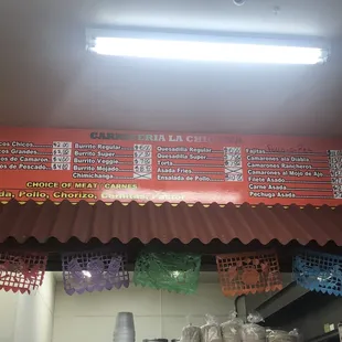 Menu of the taqueria inside the store