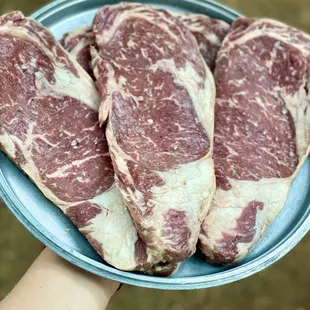 a plate of steaks