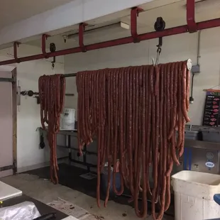 meat hanging from hooks