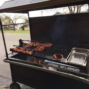 a grill with meat on it