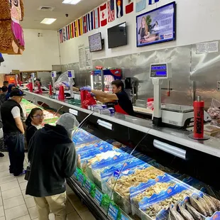 people shopping in a carniceria