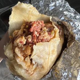 RAW ground beef when it's supposed to be a sausage breakfast burrito.